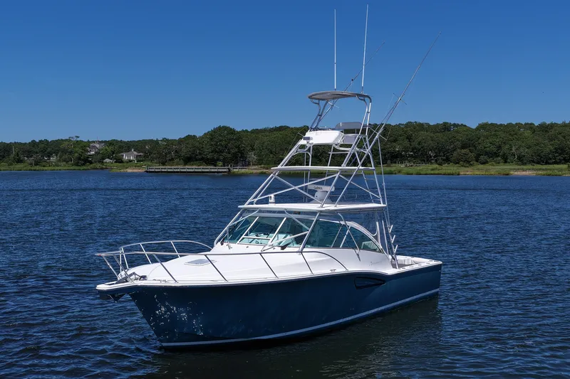 Slide: The Image of 2018 Albemarle 36 Express boat on calm water under clear blue sky. - 3