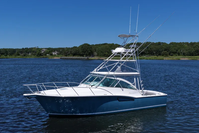 Slide: The Image of 2018 Albemarle 36 Express boat on calm water under clear blue sky. - 4