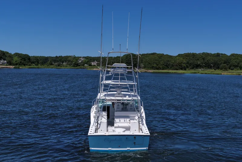 Slide: The Image of 2018 Albemarle 36 Express boat on calm water, clear blue sky background. - 9