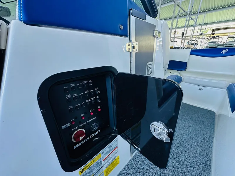 Slide: The Image of 2018 MasterCraft X23 boat interior with control panel and seating. - 22