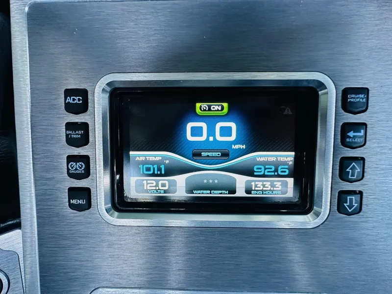 Slide: The Image of Dashboard of 2018 MasterCraft X23 boat showing speed, temperature, and engine hours. - 24