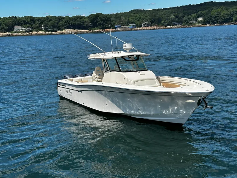 Slide: The Image of 2017 Grady-White Canyon 376 boat on water, scenic background. - 10