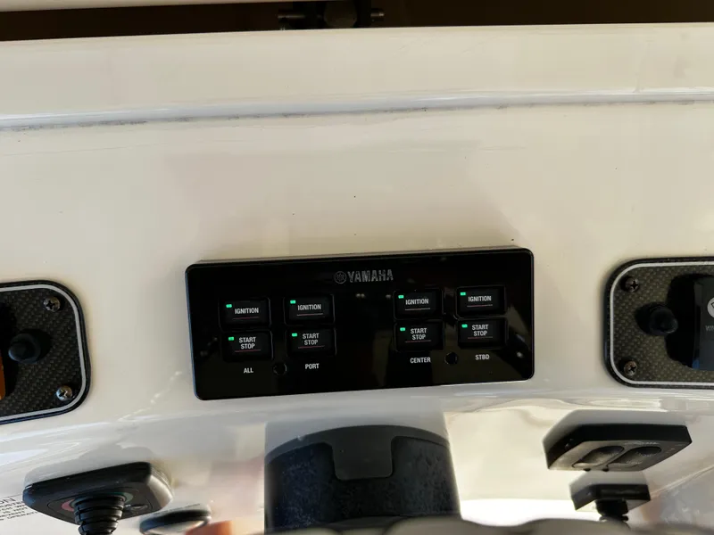 Slide: The Image of Control panel of a 2017 Grady-White Canyon 376 boat with Yamaha ignition switches. - 21