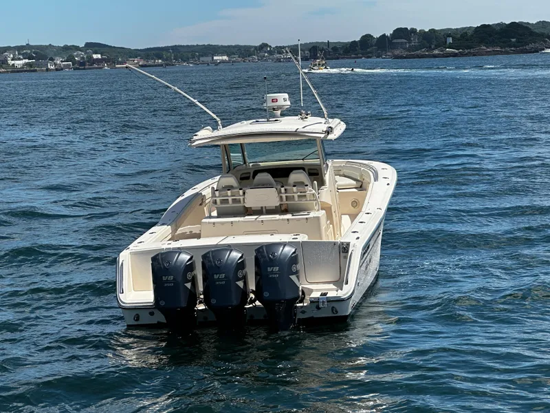 Slide: The Image of 2017 Grady-White Canyon 376 boat with triple V8 engines on open water. - 3