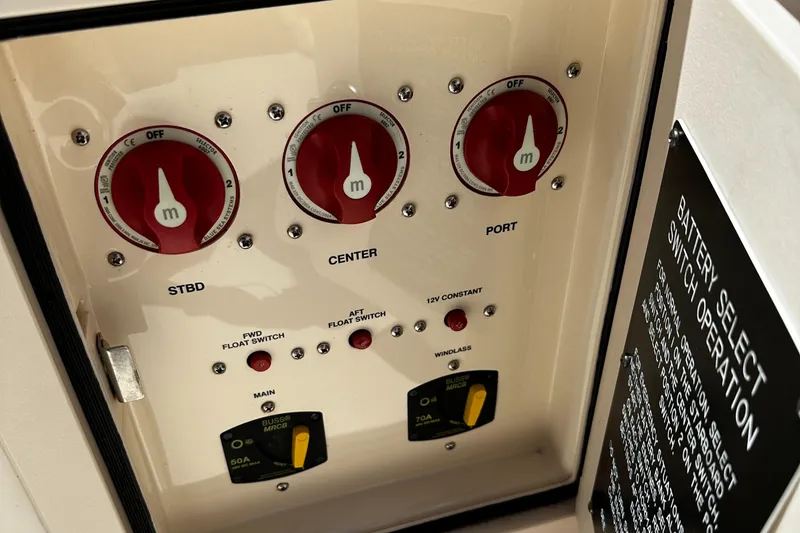 Slide: The Image of Control panel of a 2017 Grady-White Canyon 376 boat with battery switches. - 33