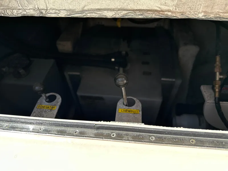 Slide: The Image of 2017 Grady-White Canyon 376 boat compartment with generator and livewell controls. - 40