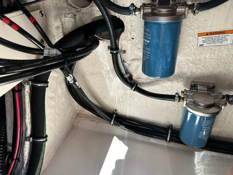 Slide: The Image of Engine compartment of 2017 Grady-White Canyon 376 with fuel filters and wiring. - 44