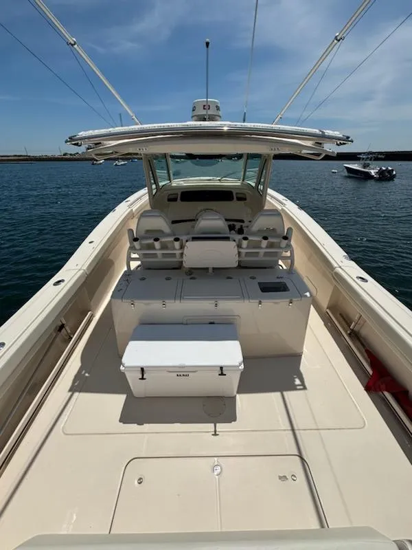 Slide: The Image of 2017 Grady-White Canyon 376 boat interior with seating and storage on open water. - 46