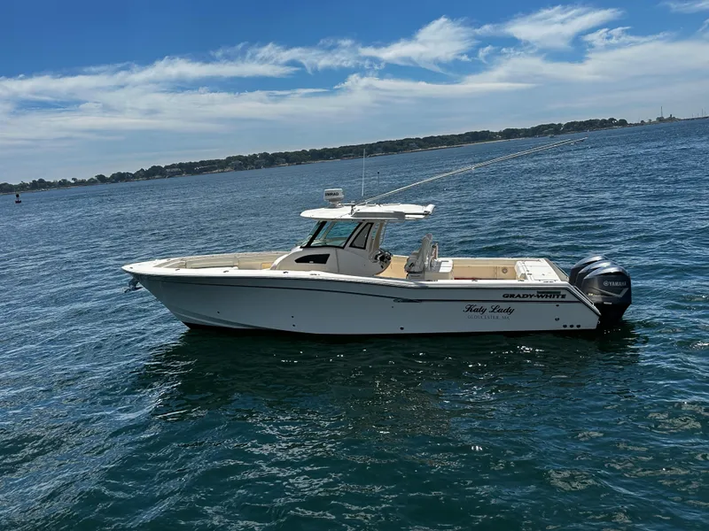 Slide: The Image of 2017 Grady-White Canyon 376 boat on calm water under a clear sky. - 6