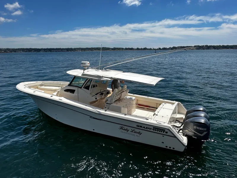 Slide: The Image of 2017 Grady-White Canyon 376 boat on calm water, featuring twin Yamaha engines. - 8