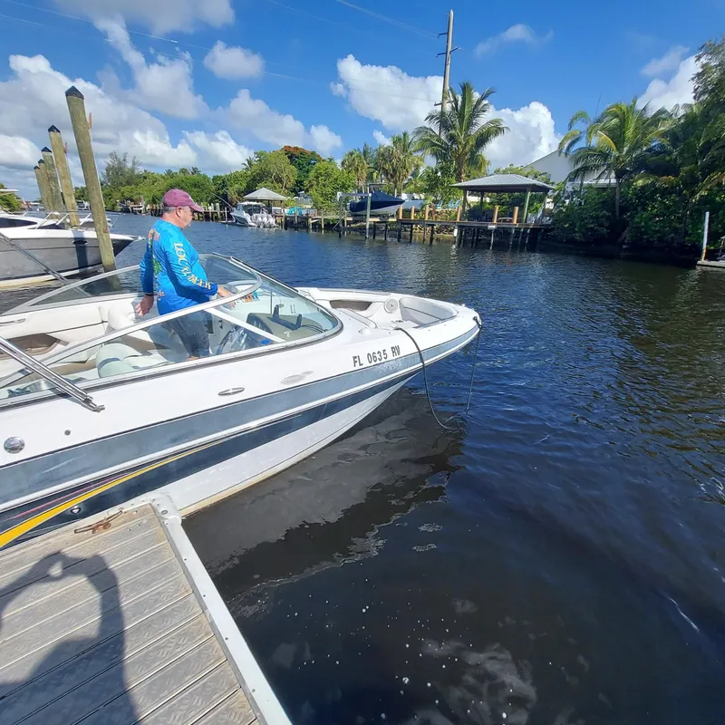 Slide: The Image of 2007 Four Winns 240 Horizon boat docked on a sunny day. - 15