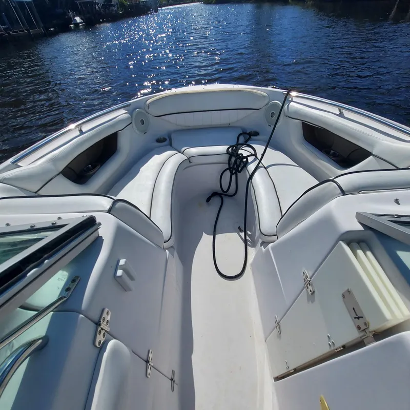 Slide: The Image of 2007 Four Winns 240 Horizon boat interior with white seating and coiled rope. - 22