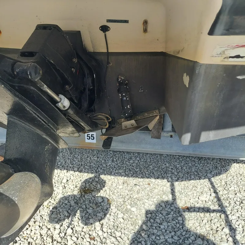 Slide: The Image of Rear view of a 2007 Four Winns 240 Horizon boat, showing the outdrive and hull details. - 3