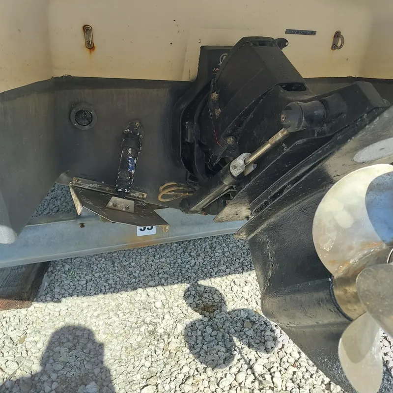 Slide: The Image of Close-up of 2007 Four Winns 240 Horizon boat propeller and stern drive on gravel. - 4