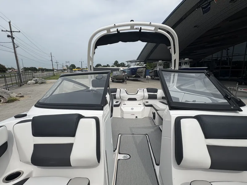 Slide: The Image of 2024 Yamaha AR 195 boat with red and white design on a trailer. - 3