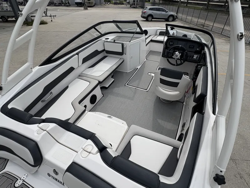 Slide: The Image of 2024 Yamaha Boats AR 195 interior, featuring sleek seating and modern dashboard design. - 9