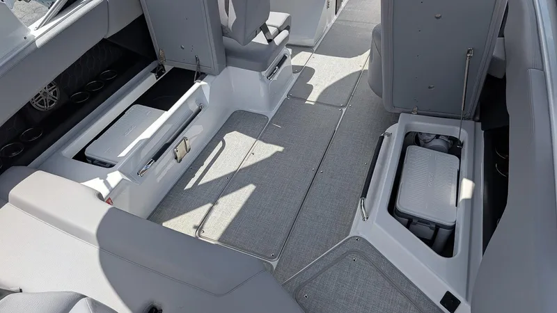 Slide: The Image of Interior of 2026 Four Winns H6 OB boat with storage compartments open. - 10