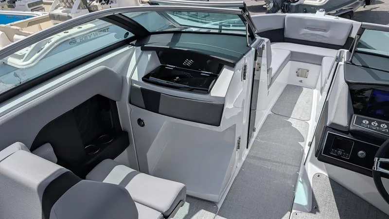 Slide: The Image of 2026 Four Winns H6 OB boat interior with modern seating and sleek dashboard design. - 15