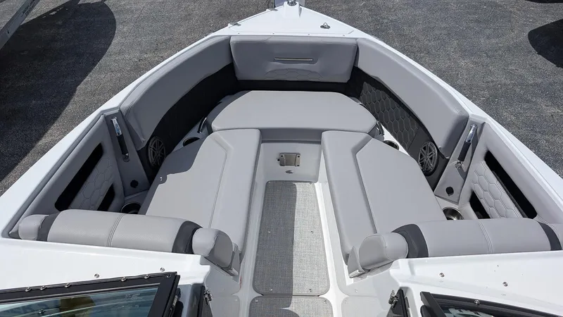 Slide: The Image of 2026 Four Winns H6 OB boat interior with gray seating and modern design. - 17