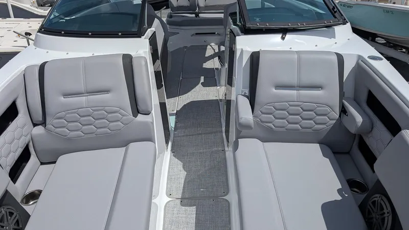 Slide: The Image of 2026 Four Winns H6 OB boat interior with gray seating and modern design. - 18