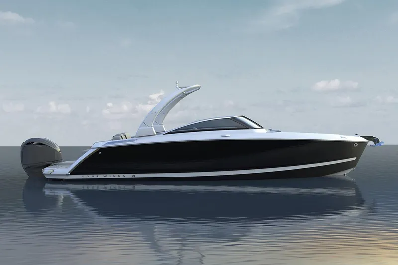 Slide: The Image of Manufacturer Provided Image: 2025 Four Winns H6 OB boat on calm water under a clear sky. - 25