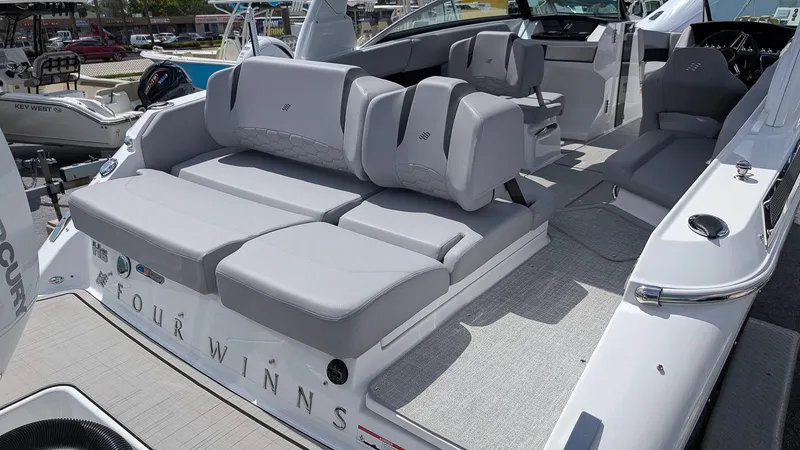 Slide: The Image of 2026 Four Winns H6 OB boat with luxurious seating and modern design. - 5