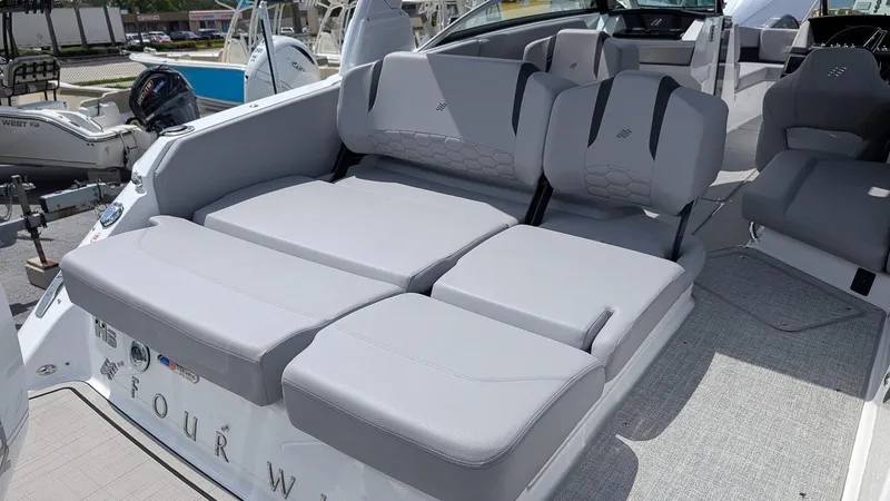 Slide: The Image of 2026 Four Winns H6 OB boat with luxurious gray seating and modern design. - 6