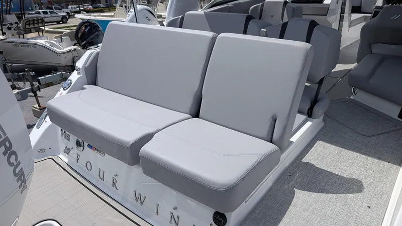 Slide: The Image of 2026 Four Winns H6 OB boat with gray seating and modern interior design. - 7