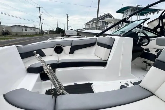 Slide: The Image of 2013 Yamaha Boats 212X interior with sleek seating and modern design. - 16