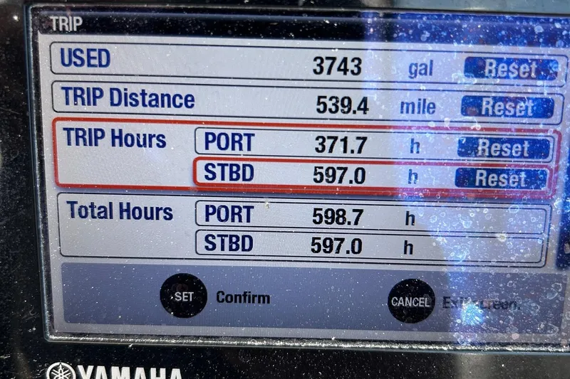 Slide: The Image of Display screen showing trip data for a 2015 Pursuit DC 325 Dual Console boat. - 19