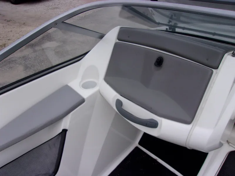 Slide: The Image of 2010 Sea-Doo 180 Challenger SE boat interior with gray and white dashboard. - 10