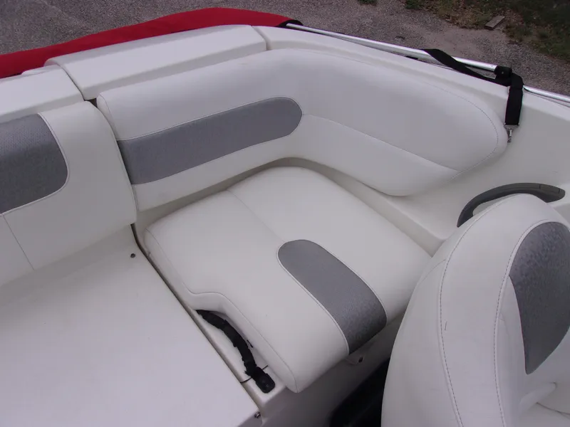 Slide: The Image of 2010 Sea-Doo 180 Challenger SE boat interior with white and gray seating. - 15