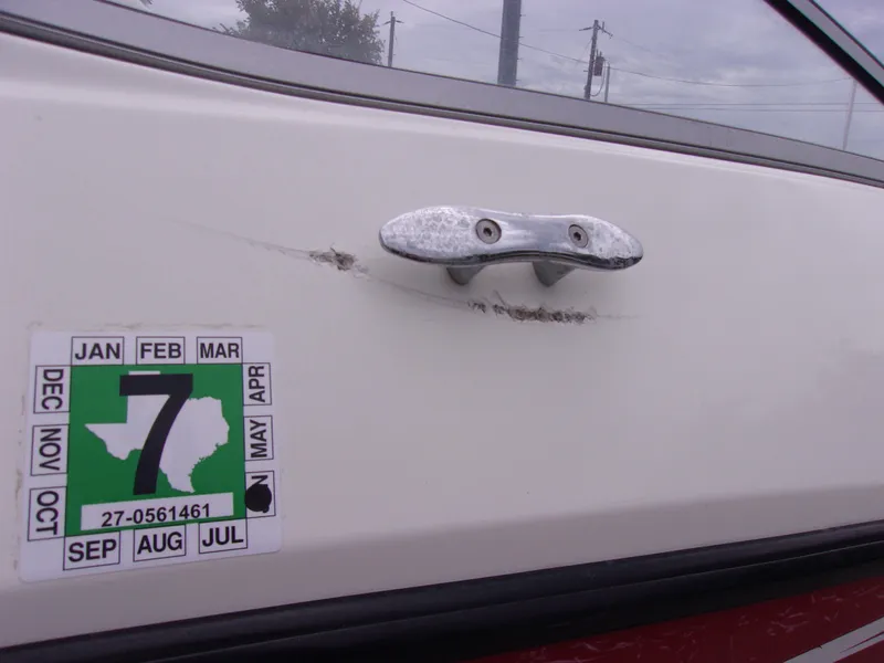 Slide: The Image of 2010 Sea-Doo 180 Challenger SE with registration sticker and metal cleat. - 5