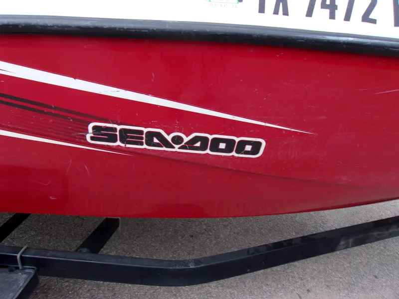 Slide: The Image of Red 2010 Sea-Doo Sport Boats 180 Challenger SE with logo and registration number. - 7