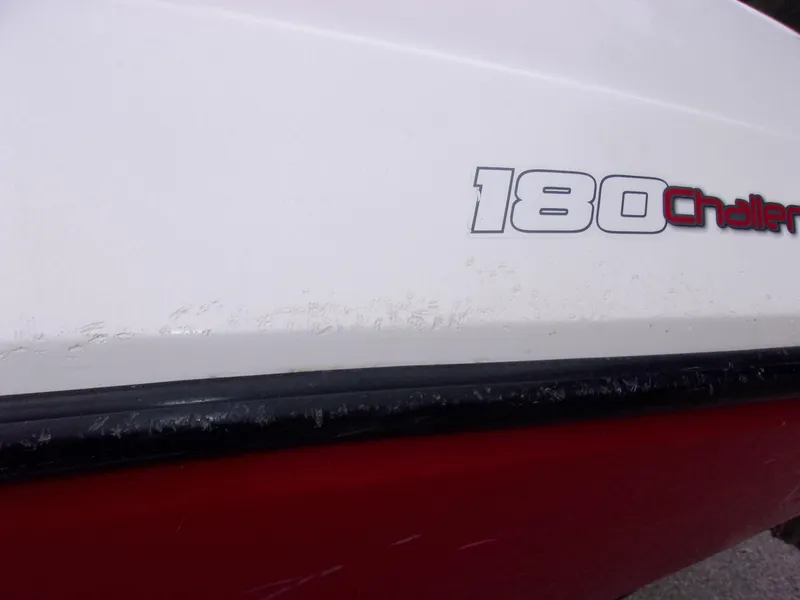 Slide: The Image of 2010 Sea-Doo Sport Boats 180 Challenger SE, close-up of boat hull and logo. - 8