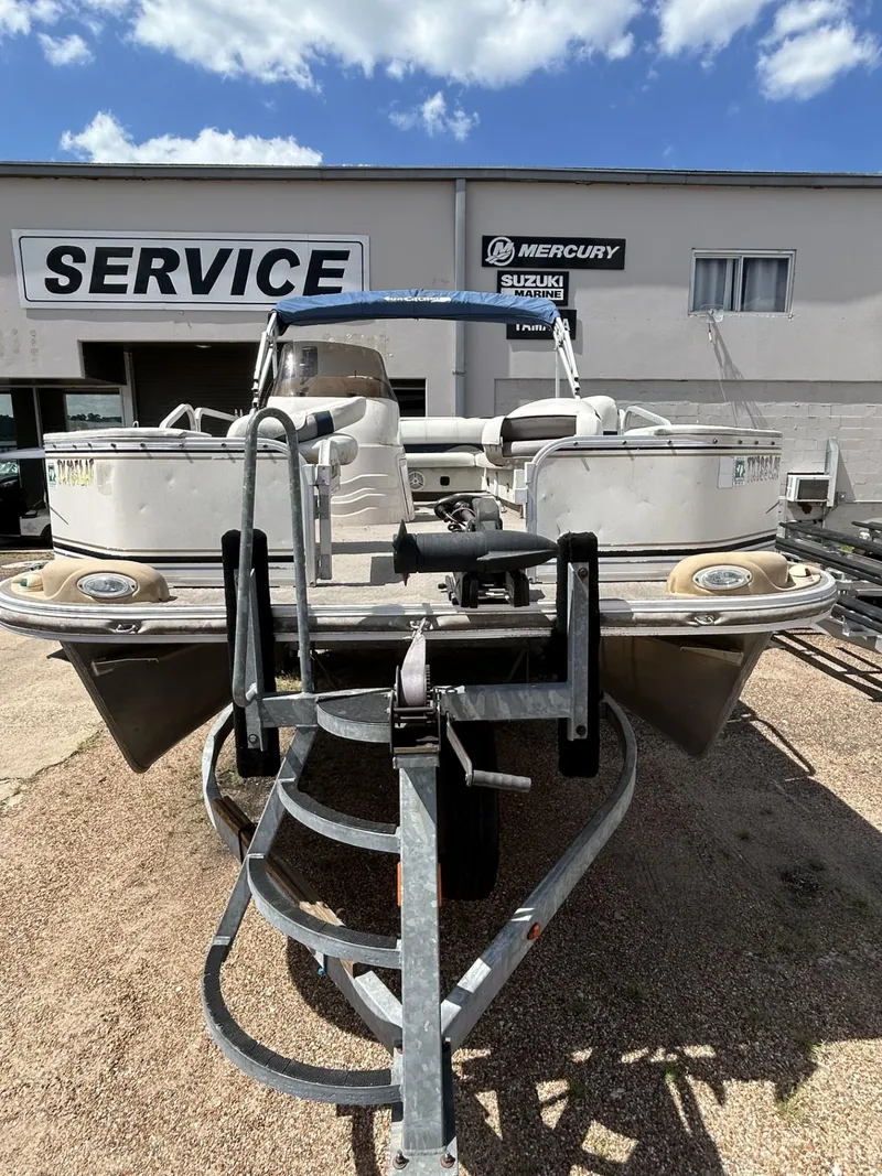 Slide: The Image of 2006 SunCatcher LX 20 Fish & Cruise boat on trailer at service center. - 3