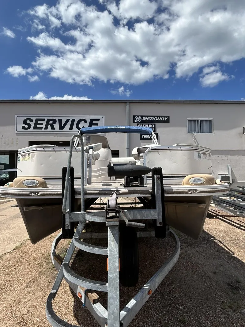 Slide: The Image of 2006 SunCatcher LX 20 Fish & Cruise boat on trailer at service center. - 4
