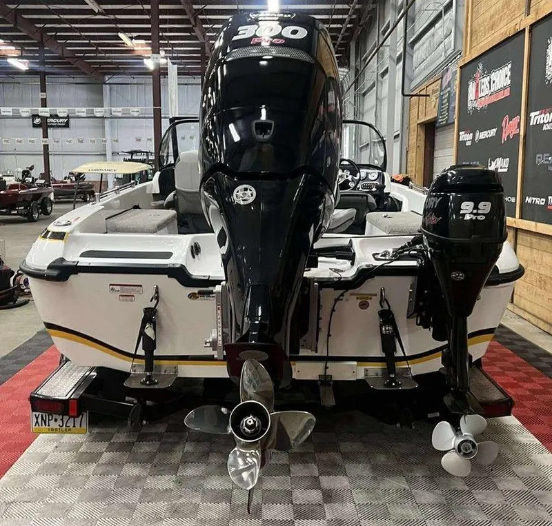 Slide: The Image of 2014 Nitro ZV 21 boat with dual Mercury engines in a showroom. - 5