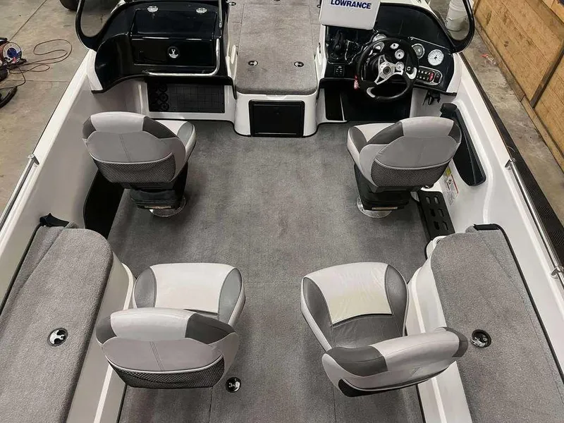 Slide: The Image of Interior of a 2014 Nitro ZV 21 boat with gray seating and steering console. - 7