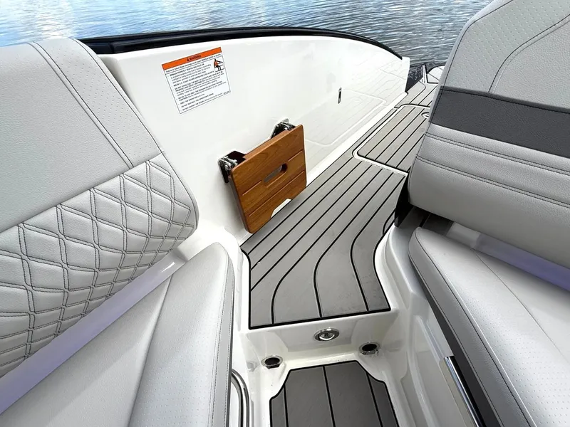 Slide: The Image of The image shows the sleek interior of a Sea Ray SLX 280 boat with gray upholstery. - 22