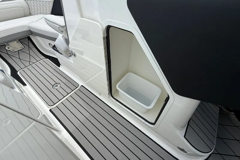 Slide: The Image of The image shows the floor area of a Sea Ray SLX 280 boat with gray and white accents. - 11
