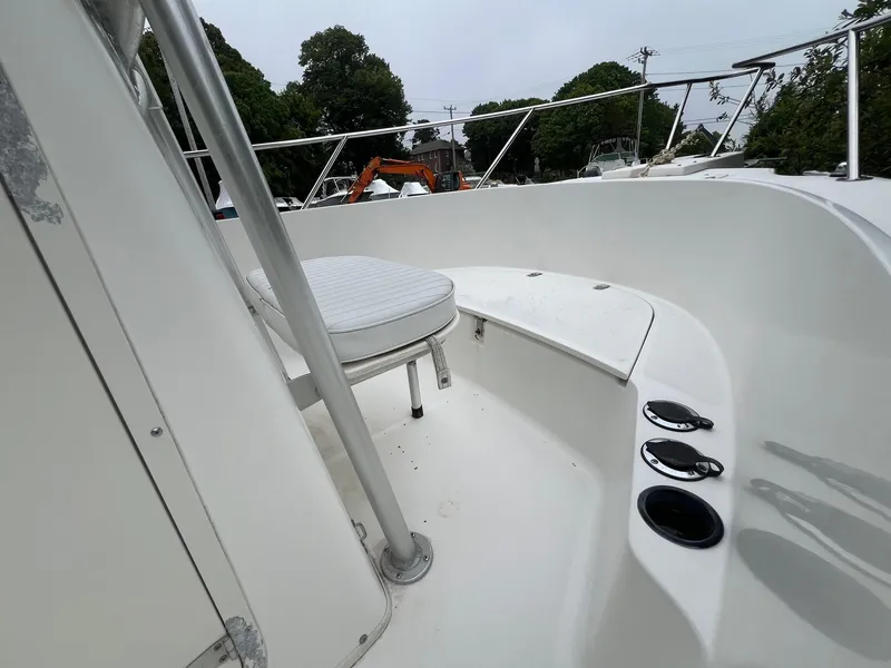 Slide: The Image of 2001 Boston Whaler 21 Outrage boat interior with seating and cup holders. - 7