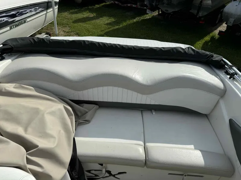 Slide: The Image of 2006 Glastron SX 175 boat interior with white and gray seating. - 8