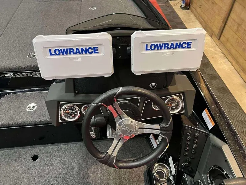 Slide: The Image of 2022 Ranger Z519 boat dashboard with dual Lowrance displays and steering wheel. - 1