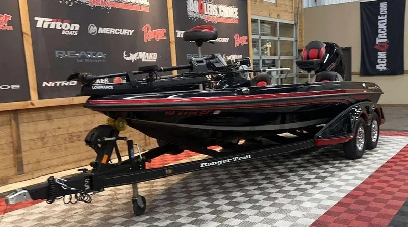 Slide: The Image of 2022 Ranger Z519 boat on display with trailer in showroom. - 5