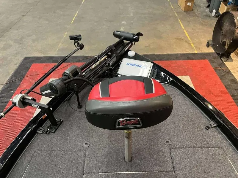 Slide: The Image of 2022 Ranger Z519 boat interior with Lowrance equipment and red-black seat. - 7