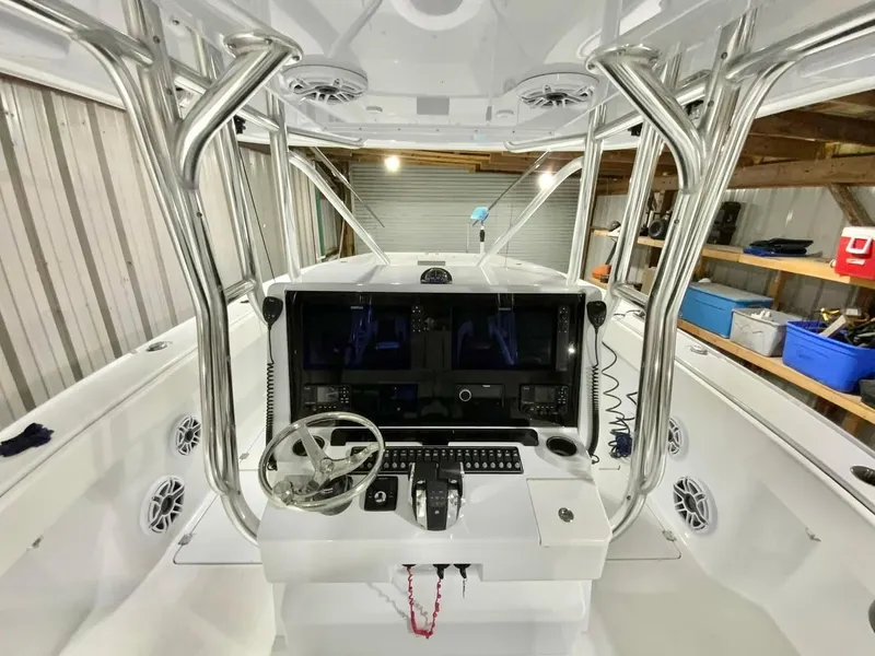 Slide: The Image of 2023 Freeman 34VH boat cockpit with advanced navigation system and sleek design. - 14