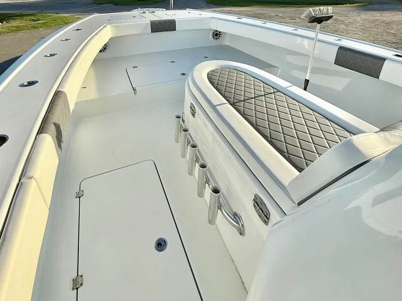 Slide: The Image of 2023 Freeman 34VH boat interior with cushioned seating and rod holders. - 16