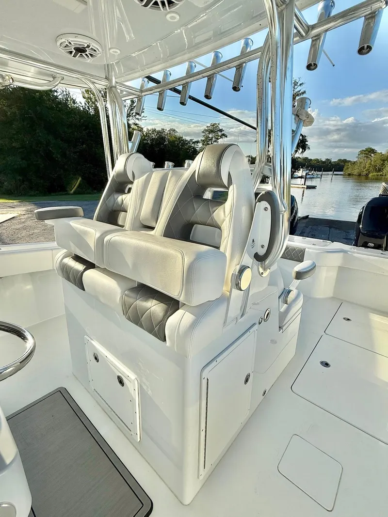 Slide: The Image of Luxury seating on a 2023 Freeman 34VH boat, featuring plush, diamond-stitched upholstery. - 18