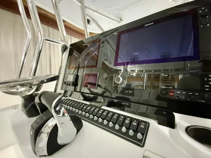 Slide: The Image of Control panel of 2023 Freeman 34VH boat with advanced navigation and communication systems. - 19